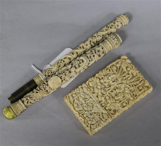 A Chinese ivory carved card case and two parasol handles